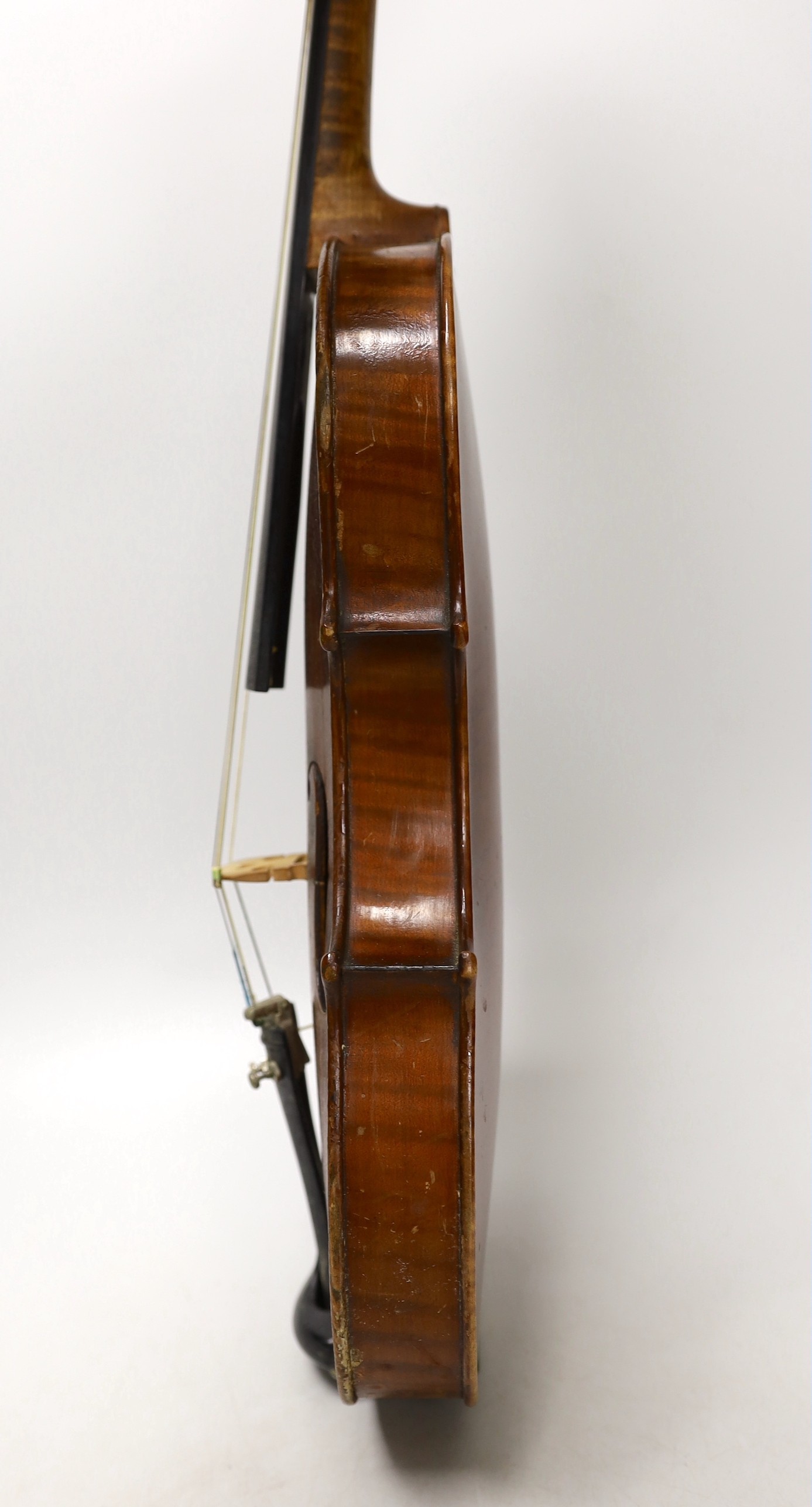 A cased French double backed violin, interior label reads ‘Copie de J.B. Vuillaume à Paris.’ Back measures 36cm excluding button
